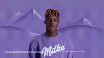 A Man In A Blue Oreo Shirt Is Holding A Bar Of Oreo GIF
