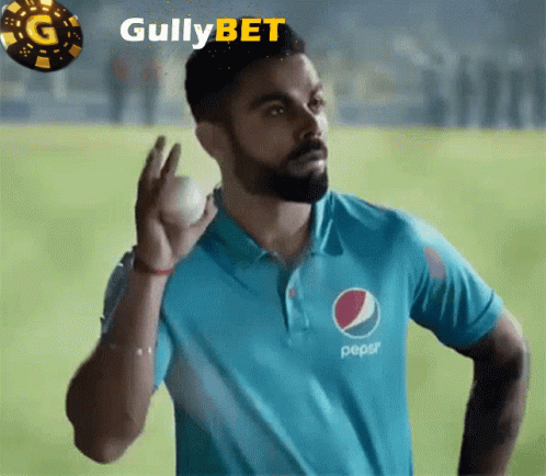 A Man In A Blue Pepsi Shirt Is Holding A Ball GIF