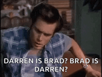 A Man In A Blue Plaid Shirt Is Sitting On A Couch And Says `` Darren Is Brad Brad Is Darren ? '' GIF