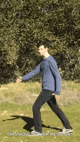 A Man In A Blue Shirt And Black Pants Is Walking In A Field With The Words " This How I Think He Look " Below Him GIF