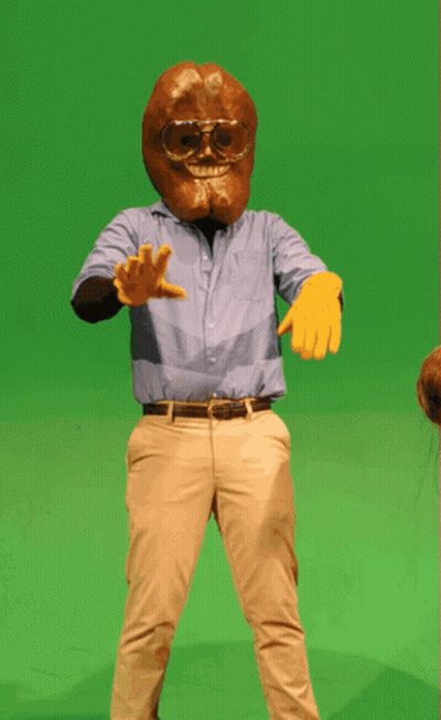 A Man In A Blue Shirt And Khaki Pants Is Wearing A Mask And Goggles GIF