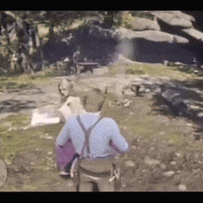 A Man In A Blue Shirt And Suspenders Is Walking In A Field With A Dog . GIF