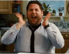 A Man In A Blue Shirt And Tie Is Making A Surprised Face GIF