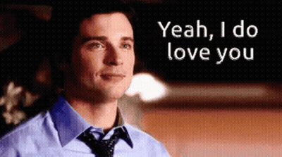 A Man In A Blue Shirt And Tie Is Saying " Yeah I Do Love You " GIF