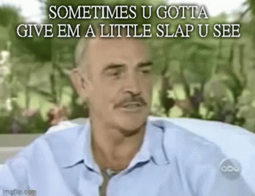 A Man In A Blue Shirt And Tie Is Sitting In A Car And Talking . GIF