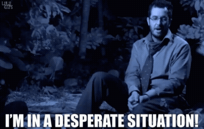 A Man In A Blue Shirt And Tie Is Sitting In A Desperate Situation GIF