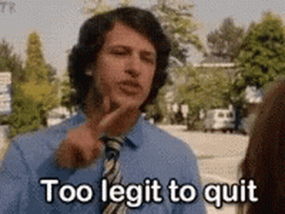 A Man In A Blue Shirt And Tie Is Talking To A Woman And Pointing At His Face . GIF