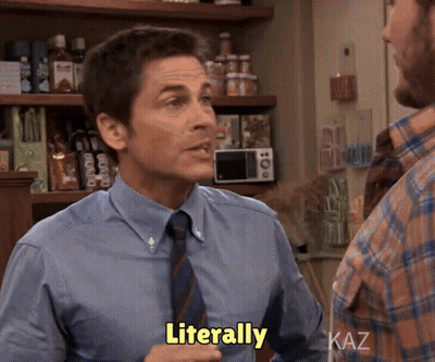 A Man In A Blue Shirt And Tie Says Literally In A Kitchen GIF