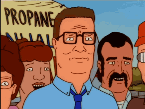 A Man In A Blue Shirt And Tie Stands In Front Of A Sign That Says Propane GIF