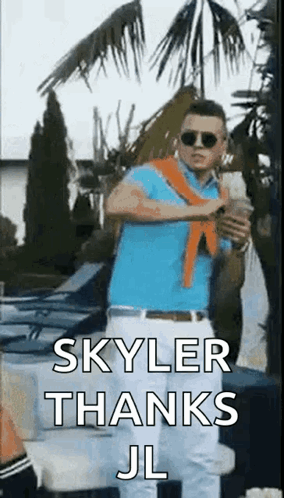 A Man In A Blue Shirt And White Pants Is Standing In Front Of A Palm Tree Holding A Cup Of Coffee . GIF