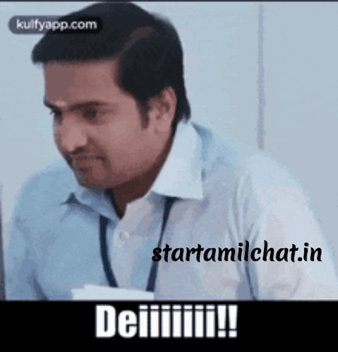 A Man In A Blue Shirt And White Shirt Is Sitting In Front Of A Computer With The Words Starttamilchat.in Written On The  GIF