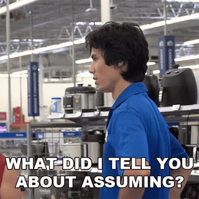 A Man In A Blue Shirt Asks What Did I Tell You About Assuming In A Store GIF