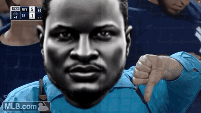 A Man In A Blue Shirt Gives A Thumbs Down Sign GIF
