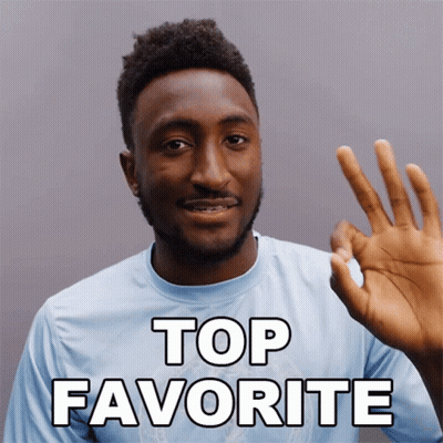 A Man In A Blue Shirt Giving An Ok Sign With The Words Top Favorite Behind Him GIF