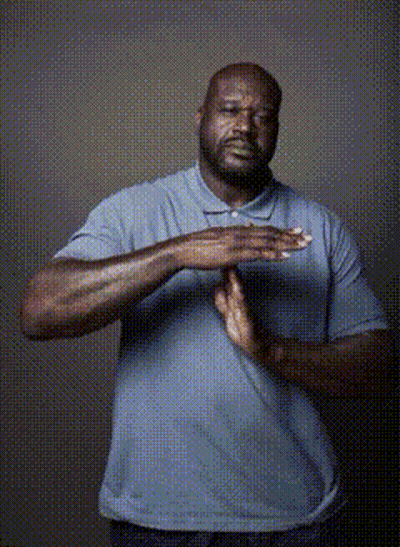 A Man In A Blue Shirt Has His Hands Folded GIF