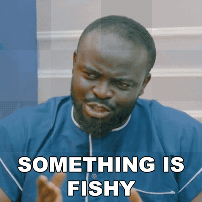 A Man In A Blue Shirt Has Something Fishy Written On His Face GIF