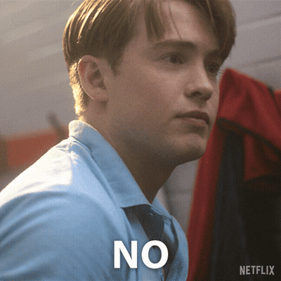 A Man In A Blue Shirt Has The Word No Written On His Chest GIF