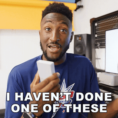 A Man In A Blue Shirt Holds A Cell Phone And Says I Haven 'T Done One Of These GIF