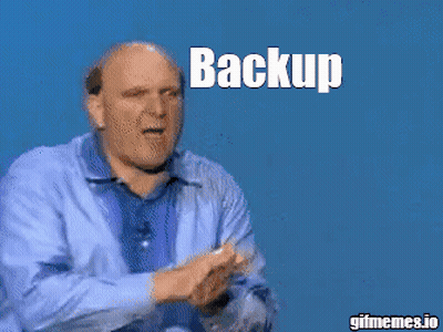 A Man In A Blue Shirt Is Clapping With The Words Backup Backup Above Him GIF