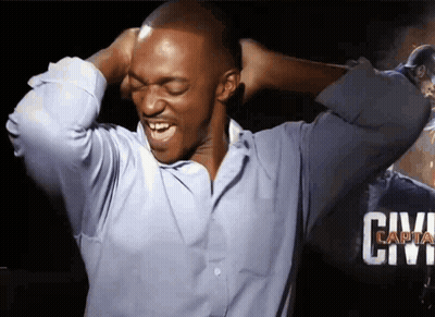 A Man In A Blue Shirt Is Covering His Ears With His Hands And The Word Civil Is Visible In The Background GIF