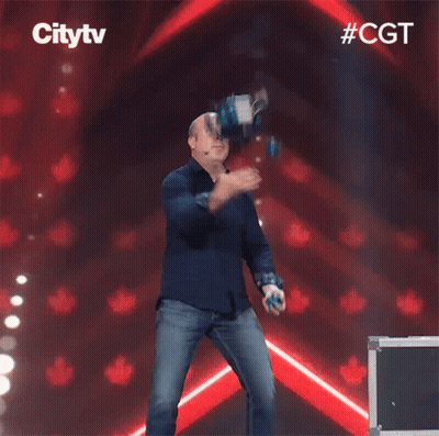 A Man In A Blue Shirt Is Dancing On A Stage In Front Of A Sign That Says City Tv GIF