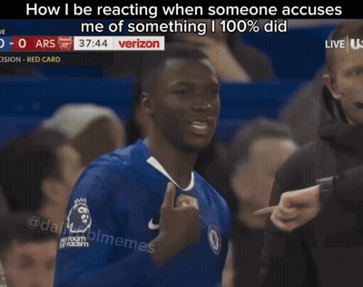 A Man In A Blue Shirt Is Giving A Thumbs Up In Front Of A Verizon Sign GIF