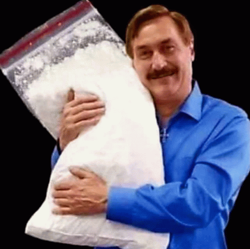 A Man In A Blue Shirt Is Holding A Large Bag Of Cocaine . GIF
