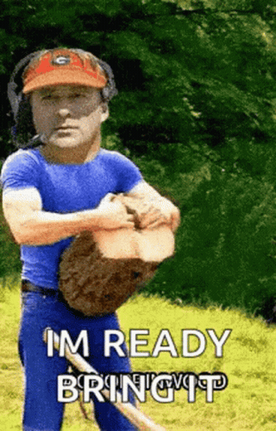 A Man In A Blue Shirt Is Holding A Log And Says I 'M Ready Bring It . GIF
