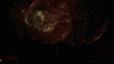 A Man In A Blue Shirt Is In A Circle With Butterflies GIF