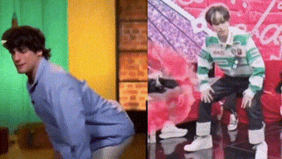 A Man In A Blue Shirt Is Kneeling Down Next To A Man In A Green And Green Striped Sweater . GIF
