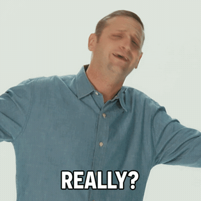 A Man In A Blue Shirt Is Making A Funny Face And Says Really GIF