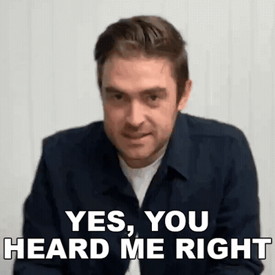 A Man In A Blue Shirt Is Making A Funny Face And Says `` Yes , You Heard Me Right '' . GIF