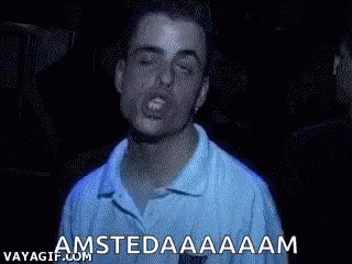 A Man In A Blue Shirt Is Making A Funny Face And Shouting Amsterdam . GIF
