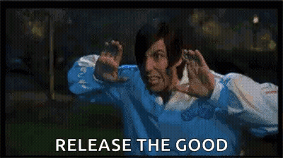 A Man In A Blue Shirt Is Making A Funny Face While Holding His Hands Up In Front Of His Face . GIF