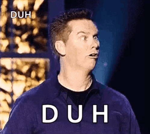 A Man In A Blue Shirt Is Making A Funny Face With The Word Duh Written On The Screen Behind Him . GIF