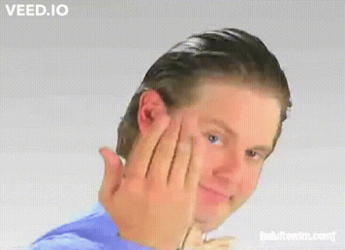 A Man In A Blue Shirt Is Making A Funny Face With Veed.io Written On The Bottom GIF