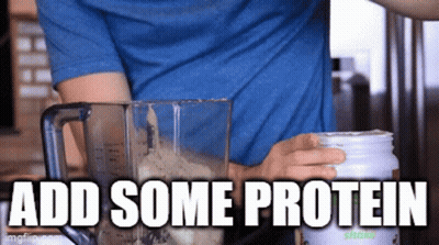 A Man In A Blue Shirt Is Making A Smoothie With The Words " Add Some Protein " Above Him GIF