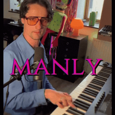 A Man In A Blue Shirt Is Playing A Keyboard With The Word Manly In Pink GIF
