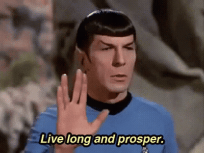 A Man In A Blue Shirt Is Saying `` Live Long And Prosper '' . GIF