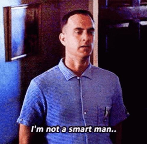 A Man In A Blue Shirt Is Saying That He Is Not A Smart Man . GIF