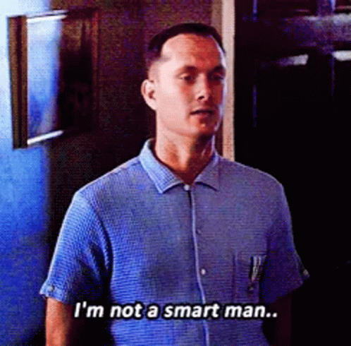 A Man In A Blue Shirt Is Saying That He Is Not A Smart Man GIF