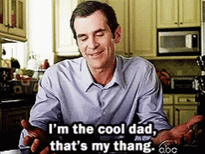A Man In A Blue Shirt Is Sitting In A Kitchen And Says I 'M The Cool Dad That 'S My Thang GIF