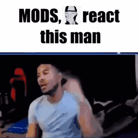 A Man In A Blue Shirt Is Sitting In Front Of A Computer Screen . GIF