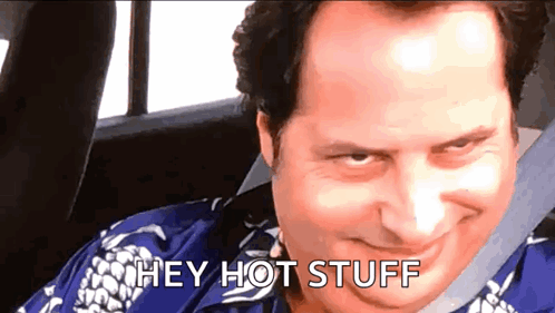 A Man In A Blue Shirt Is Sitting In The Back Seat Of A Car And Saying Hey Hot Stuff GIF