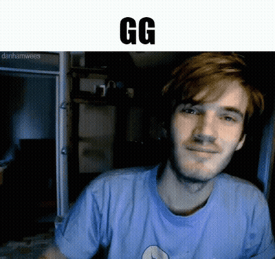 A Man In A Blue Shirt Is Smiling And The Word Gg Is Above Him . GIF