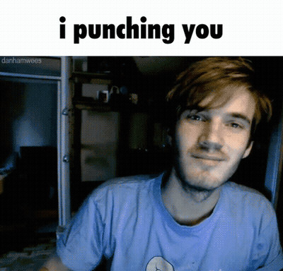 A Man In A Blue Shirt Is Smiling With The Words I Punching You Below Him GIF