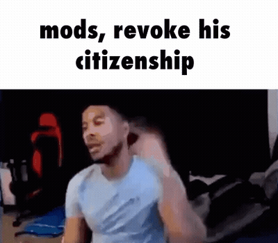 A Man In A Blue Shirt Is Standing In A Room With The Words `` Mods , Revoke His Citizenship '' . GIF