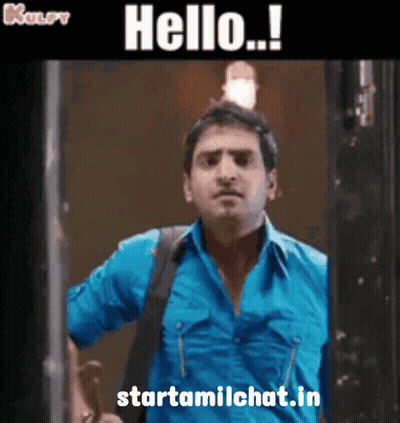 A Man In A Blue Shirt Is Standing In Front Of A Door With The Words Hello Written Above Him GIF