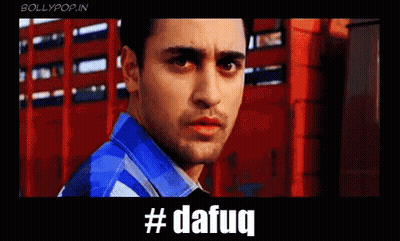 A Man In A Blue Shirt Is Standing In Front Of A Red Building With The Hashtag #Dafaq Written Below Him GIF