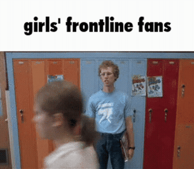 A Man In A Blue Shirt Is Standing In Front Of A Row Of Orange Lockers With The Words Girls ' Frontline Fans Above Him GIF